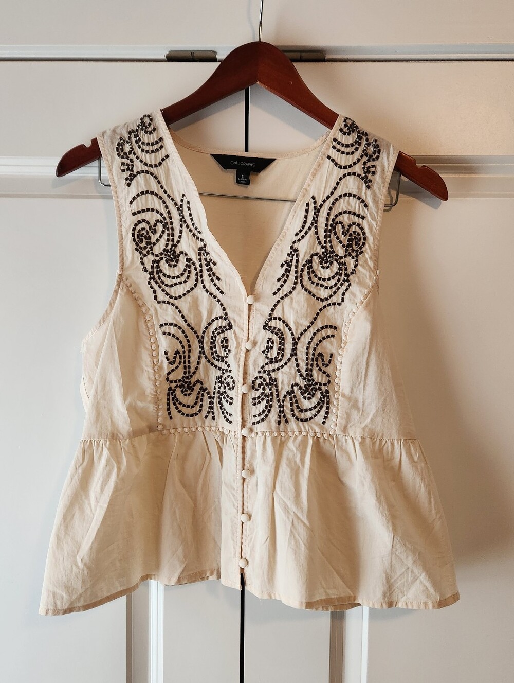 Sleeveless Peplum Top